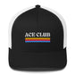 White and black trucker hat with colorful stripes and the text Ace Club on the front of it. 